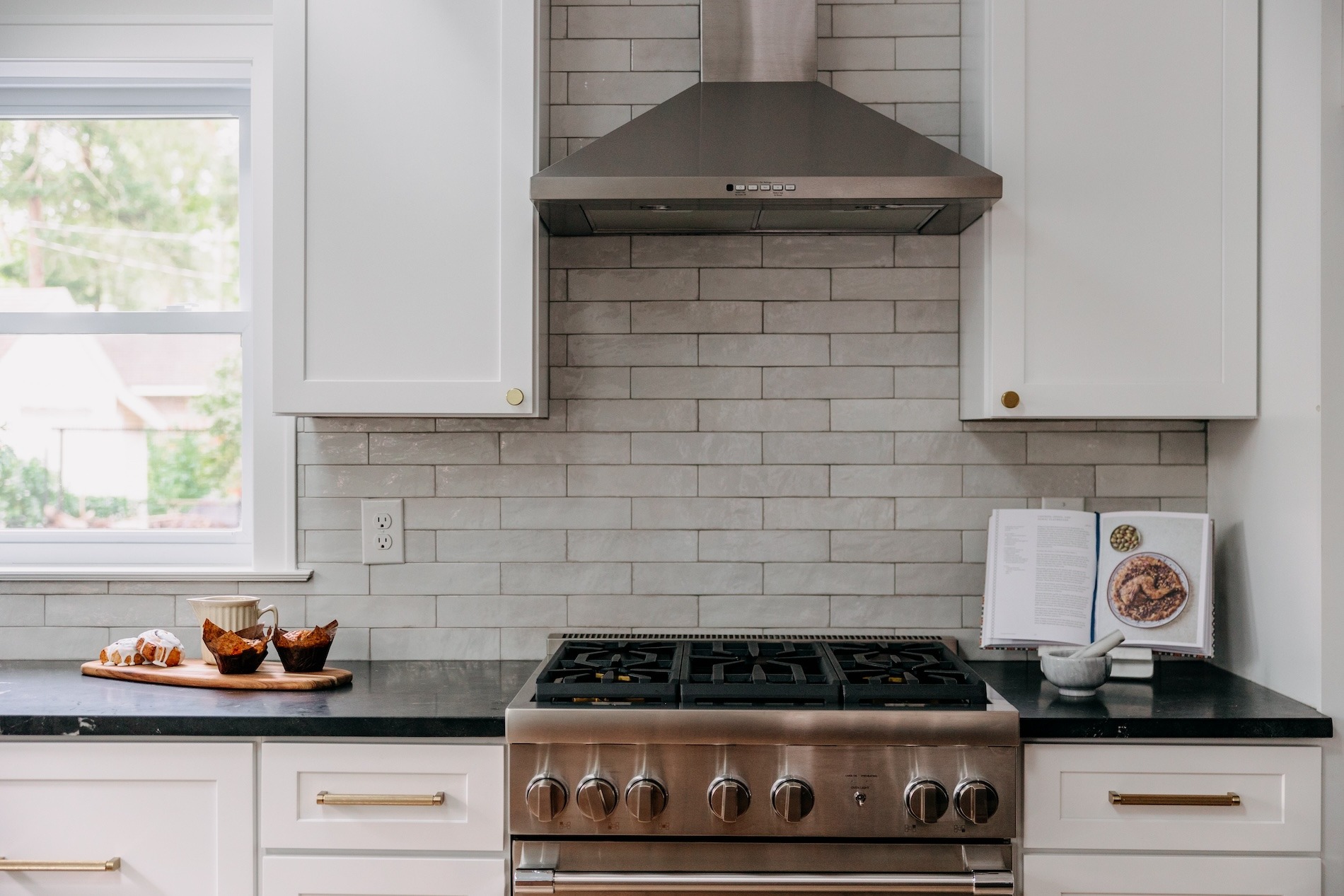 Stainless Range And Hood Tile Backsplash